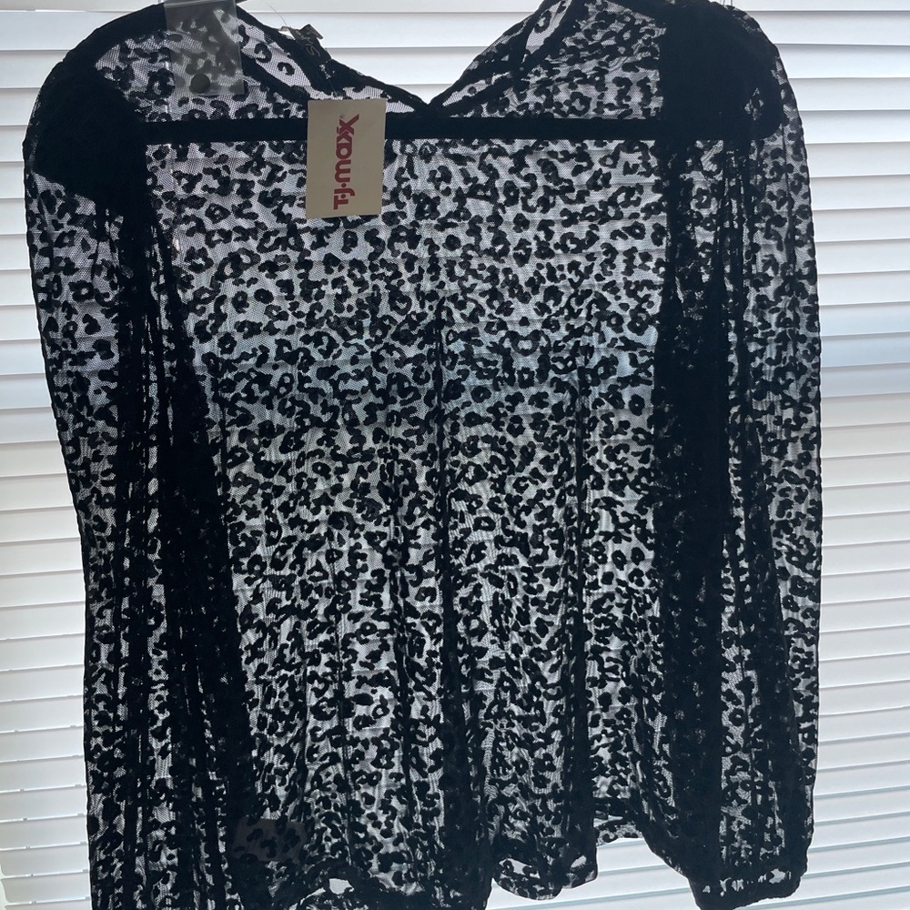 Black woman’s blouse. Leopard see through.